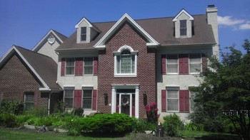 Exterior painting of trim, replaced rotted wood dormer trim with composite Azak material, power washed and stained rear deck